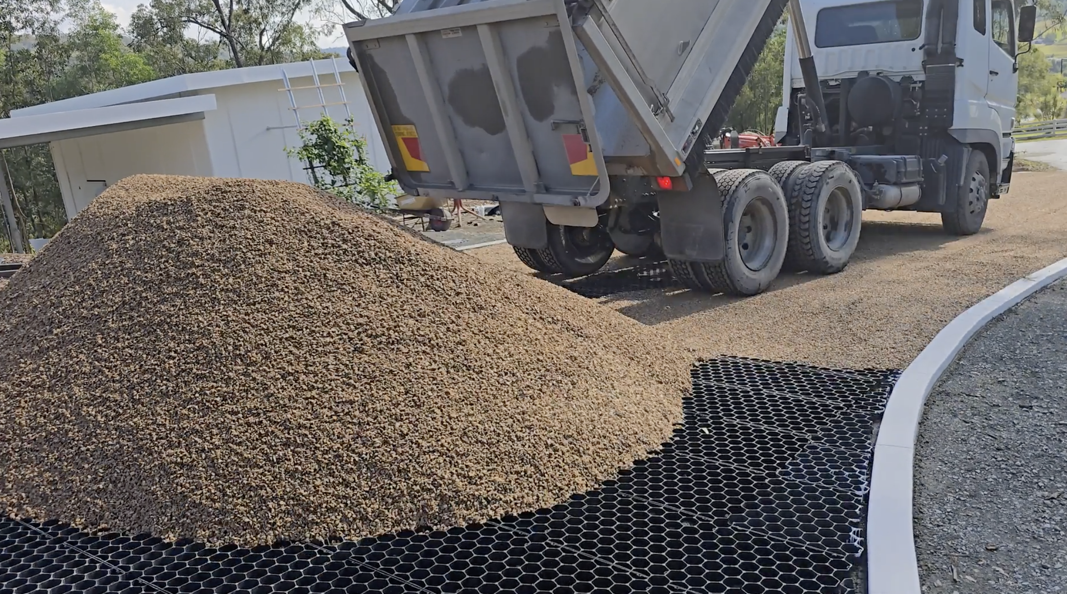 Load video: Step 3: Fill EzyHex Grids with Gravel | Complete DIY Driveway Installation